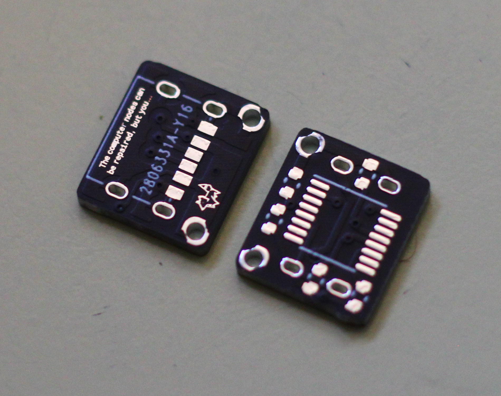 Two tiny rectangular PCB's, one side